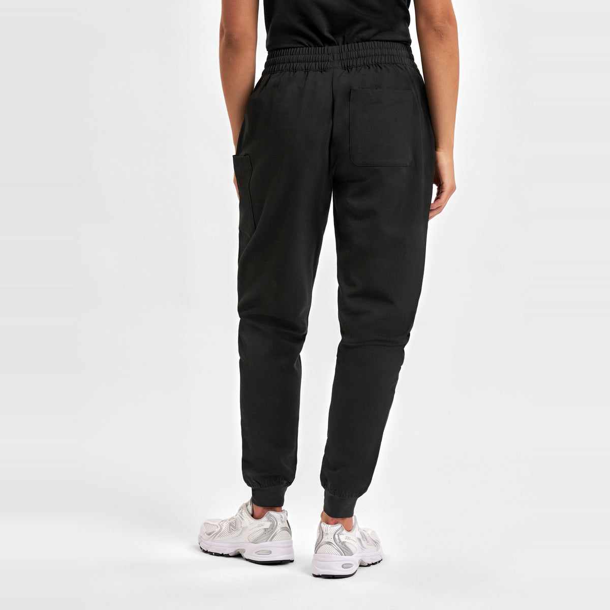 Inaura Pulse Womens Jogger Scrub Pant CL541LL in Black, worn by model, view 4