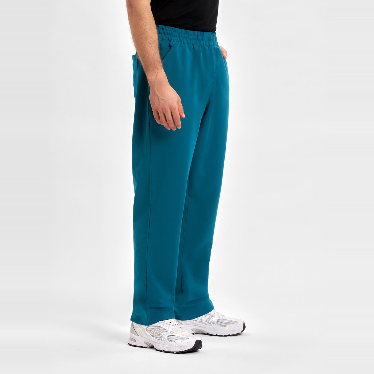 Inaura Pulse Unisex Straight Leg Scrub Pant CL542UL in Caribbean Blue, worn by model, view 3