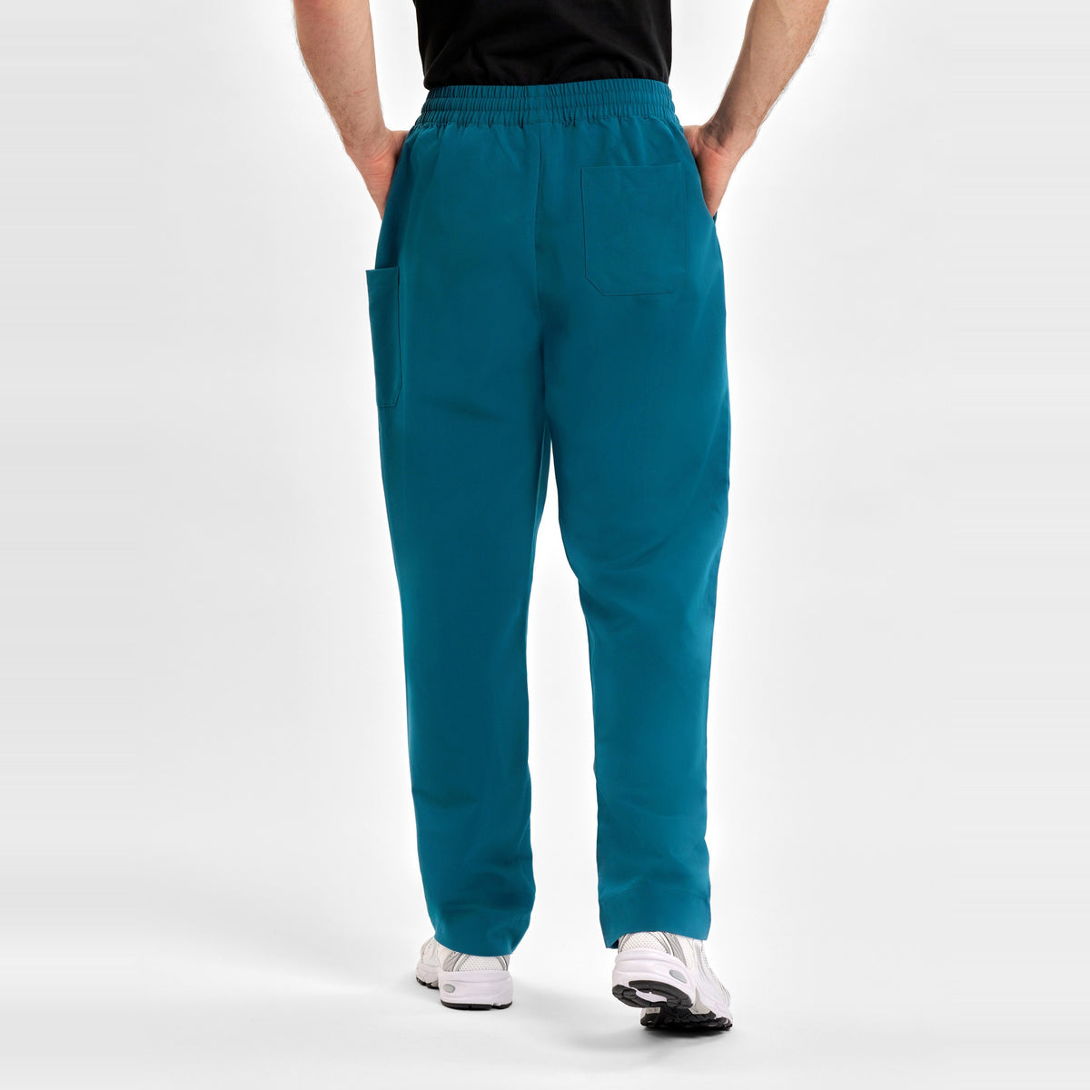 Inaura Pulse Unisex Straight Leg Scrub Pant CL542UL in Caribbean Blue, worn by model, view 5