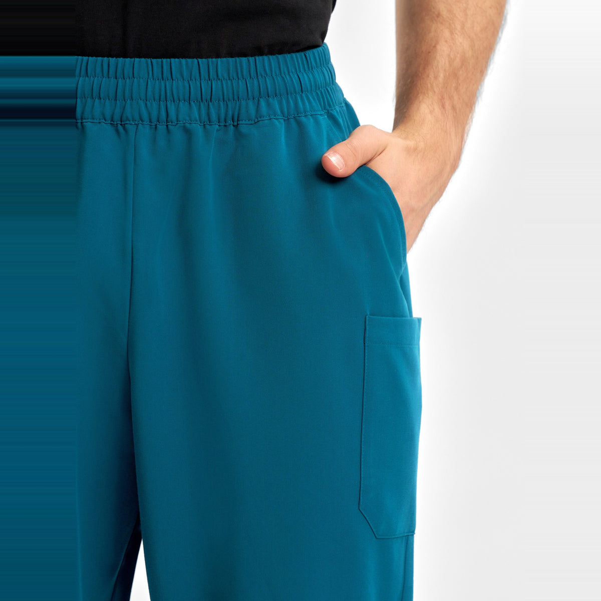 Inaura Pulse Unisex Straight Leg Scrub Pant CL542UL in Caribbean Blue, worn by model, view 6