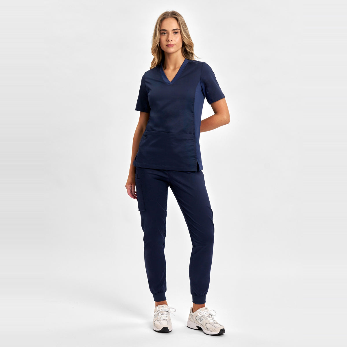 Inaura Riley Womens Slim Leg Jogger Scrub Pant CSP042LL in Midnight Navy, worn by model