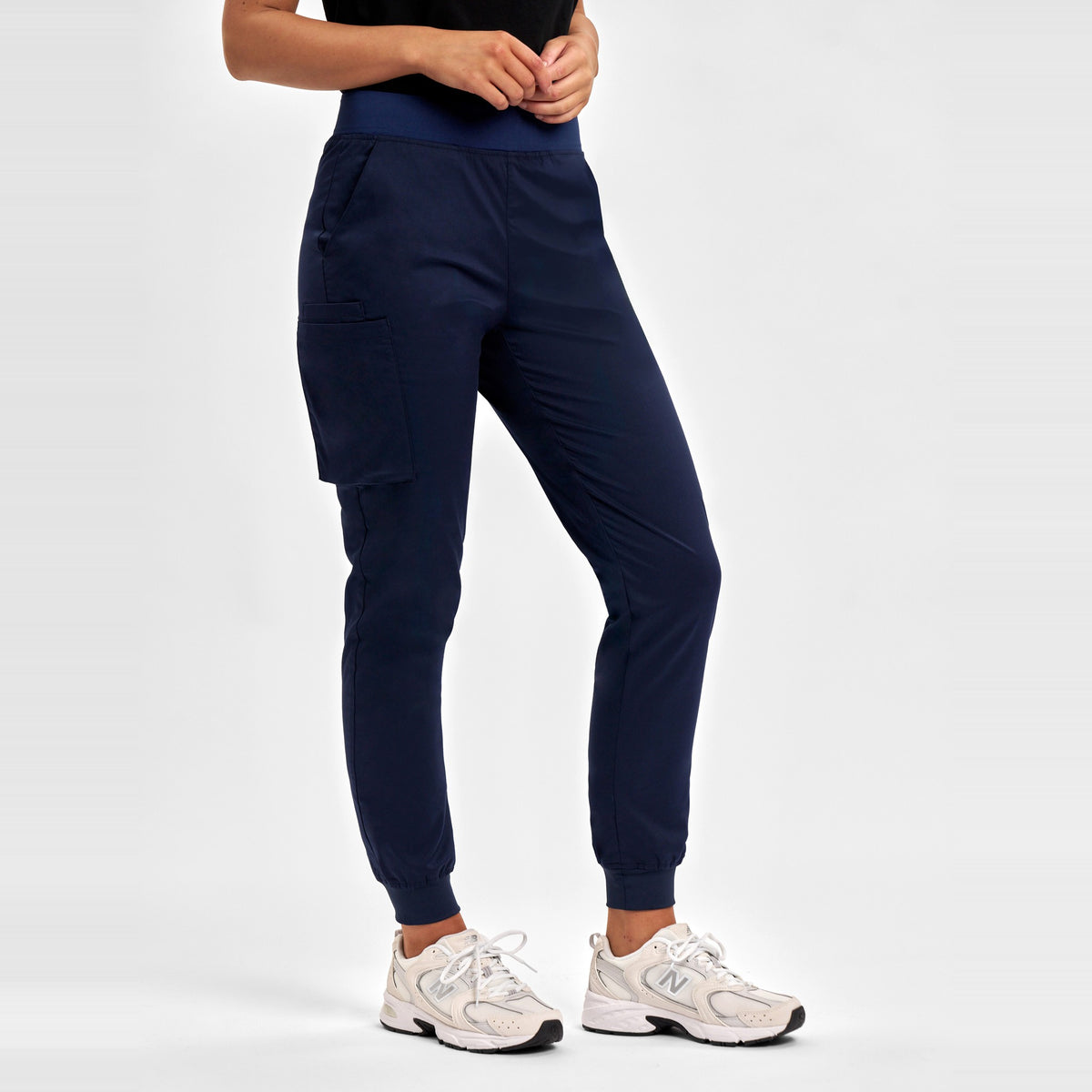 Inaura Riley Womens Slim Leg Jogger Scrub Pant CSP042LL in Midnight Navy, worn by model, view 3