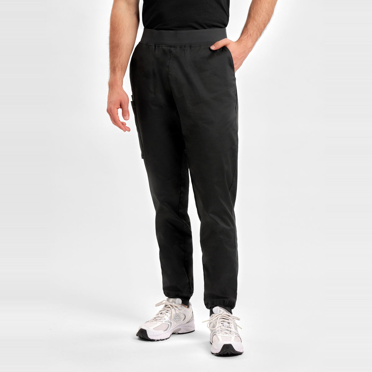 Inaura Riley Mens Slim Leg Jogger Scrub Pant CSP042ML in Black, worn by model, view 2