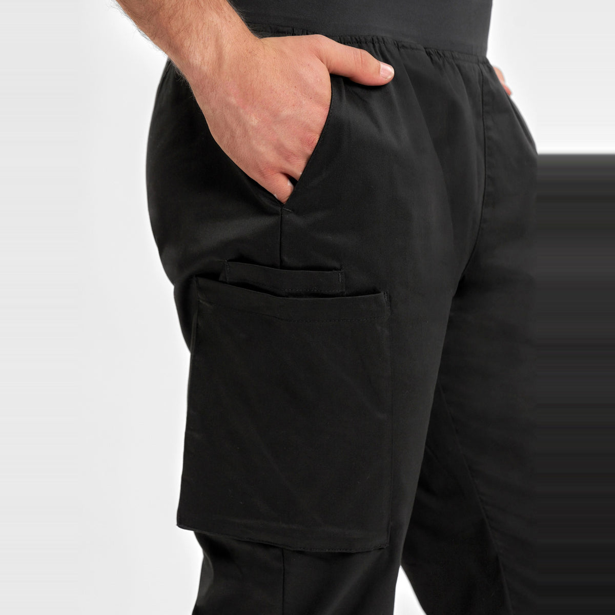 Inaura Riley Mens Slim Leg Jogger Scrub Pant CSP042ML in Black, worn by model, view 5