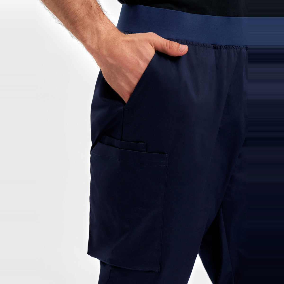 Inaura Riley Mens Slim Leg Jogger Scrub Pant CSP042ML in Midnight Navy, worn by model, view 5