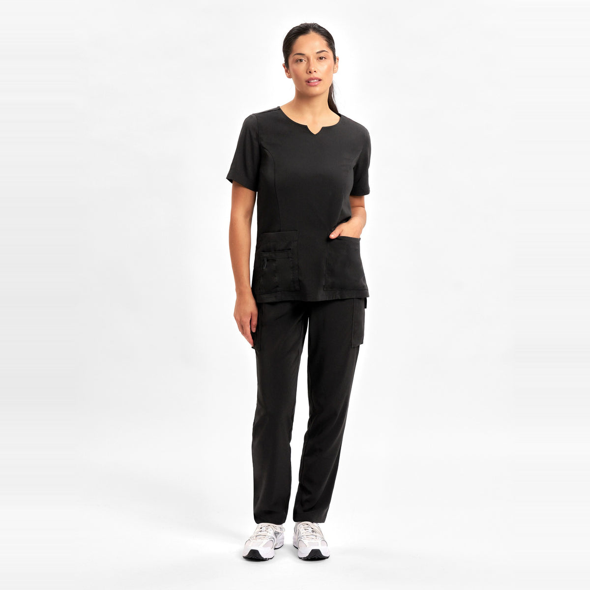Inaura Avery Womens Slim Leg Scrub Pant CSP943LL in Black, worn by model