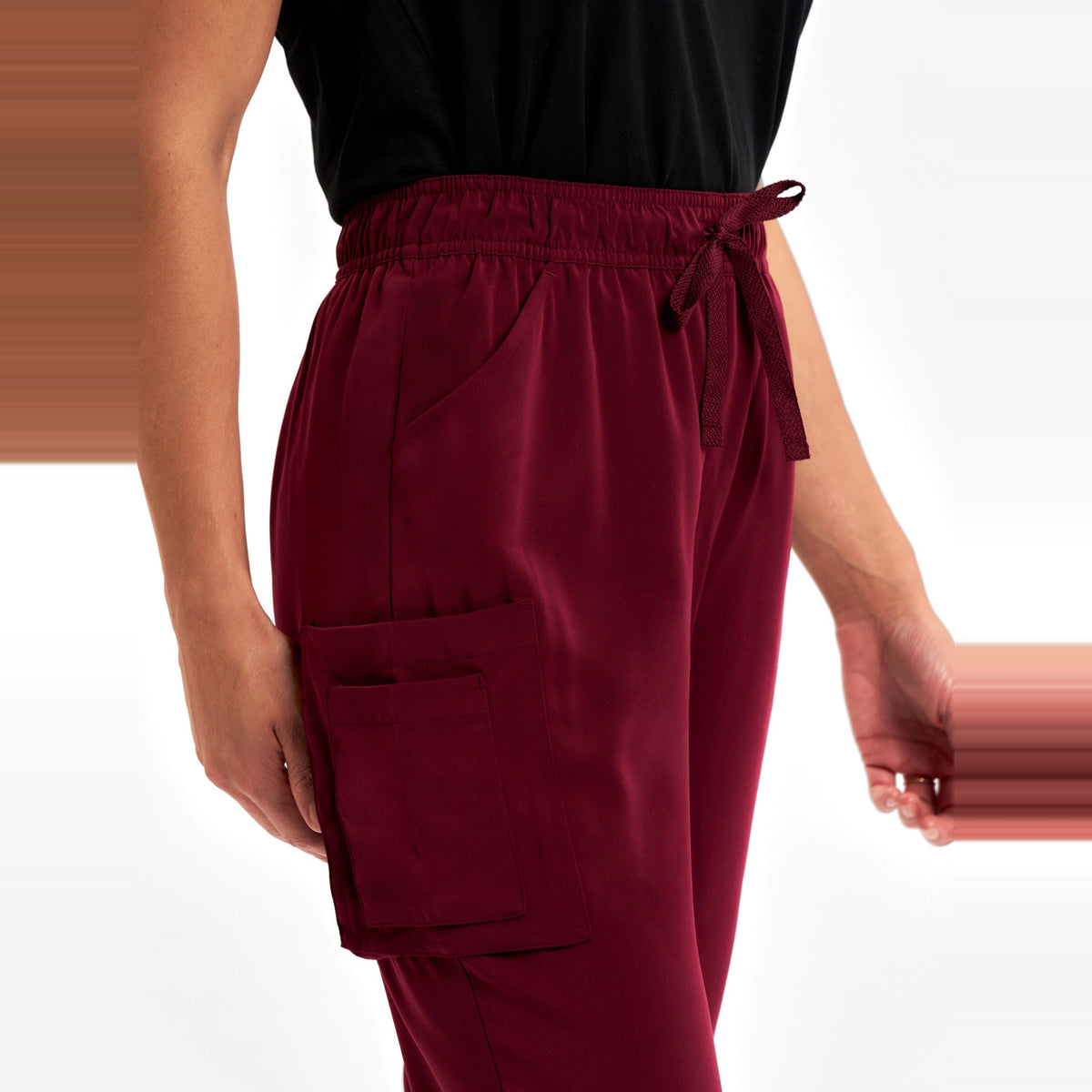 Inaura Avery Womens Slim Leg Scrub Pant CSP943LL in Burgundy, worn by model, view 5