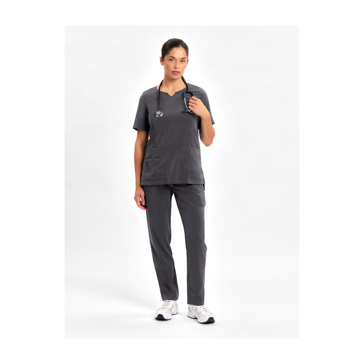 Inaura Avery Womens Slim Leg Scrub Pant CSP943LL in Charcoal, worn by model
