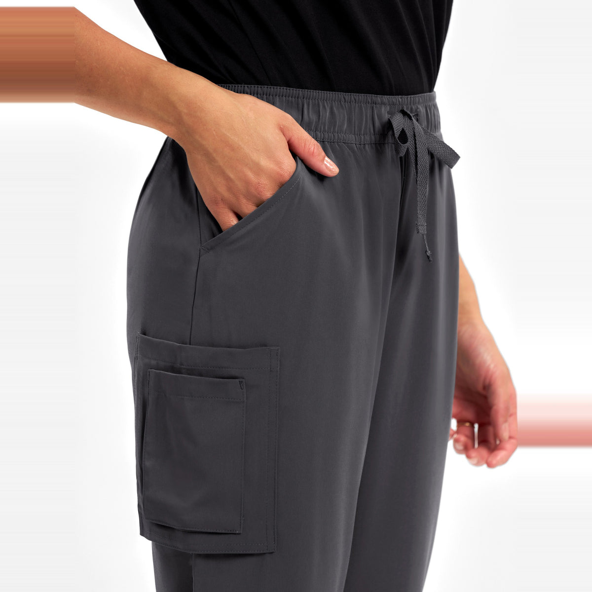 Inaura Avery Womens Slim Leg Scrub Pant CSP943LL in Charcoal, worn by model, view 5