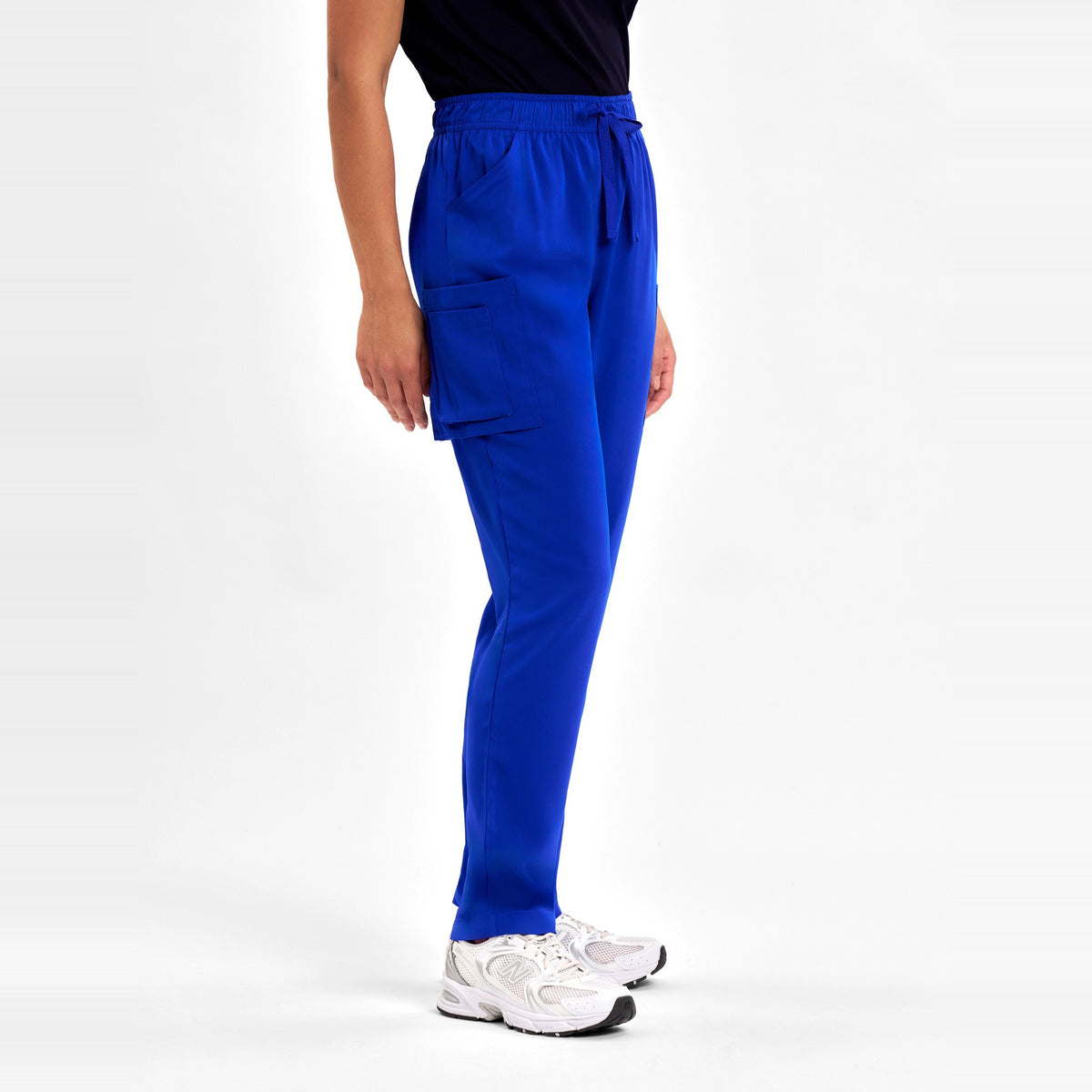 Inaura Avery Womens Slim Leg Scrub Pant CSP943LL in Electric Blue, worn by model, view 3
