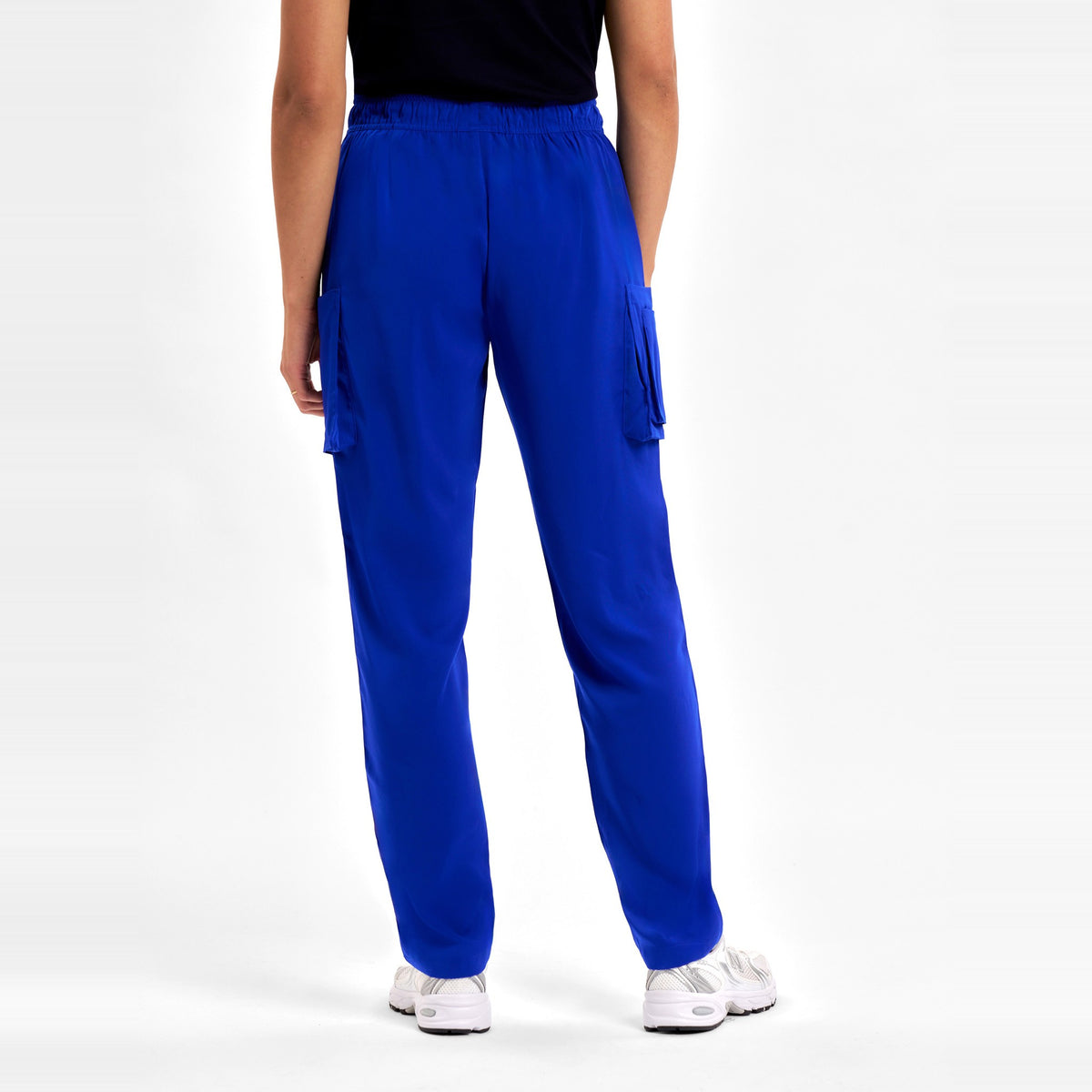 Inaura Avery Womens Slim Leg Scrub Pant CSP943LL in Electric Blue, worn by model, view 4