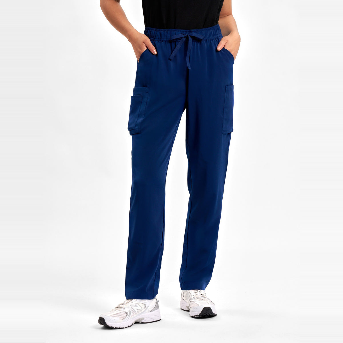 Inaura Avery Womens Slim Leg Scrub Pant CSP943LL in Navy, worn by model, view 2