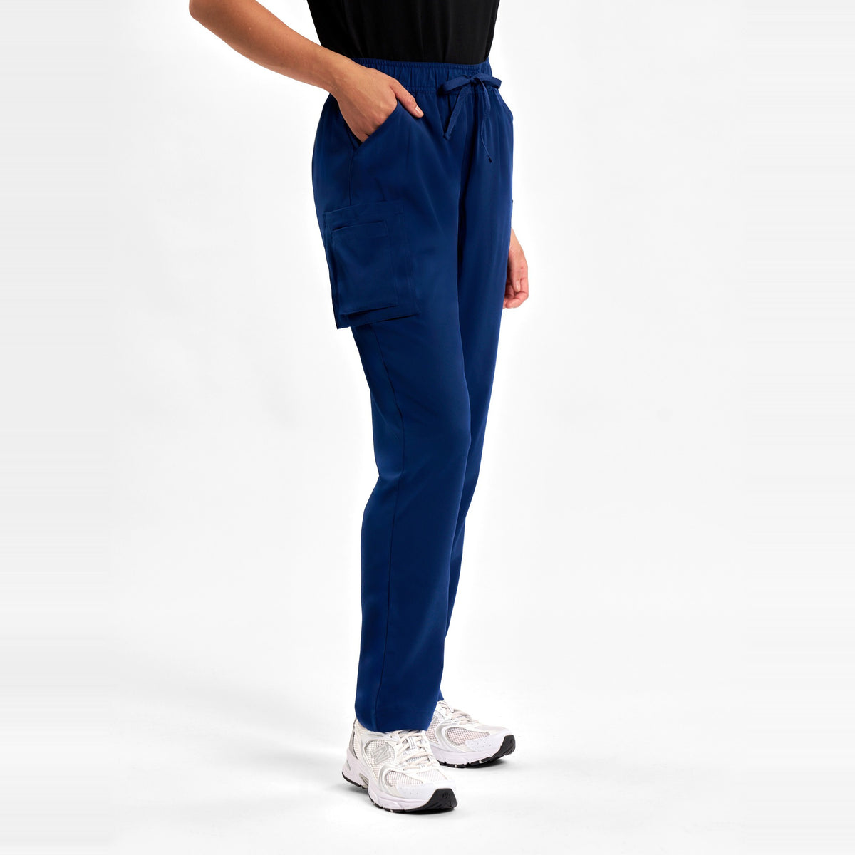 Inaura Avery Womens Slim Leg Scrub Pant CSP943LL in Navy, worn by model, view 3
