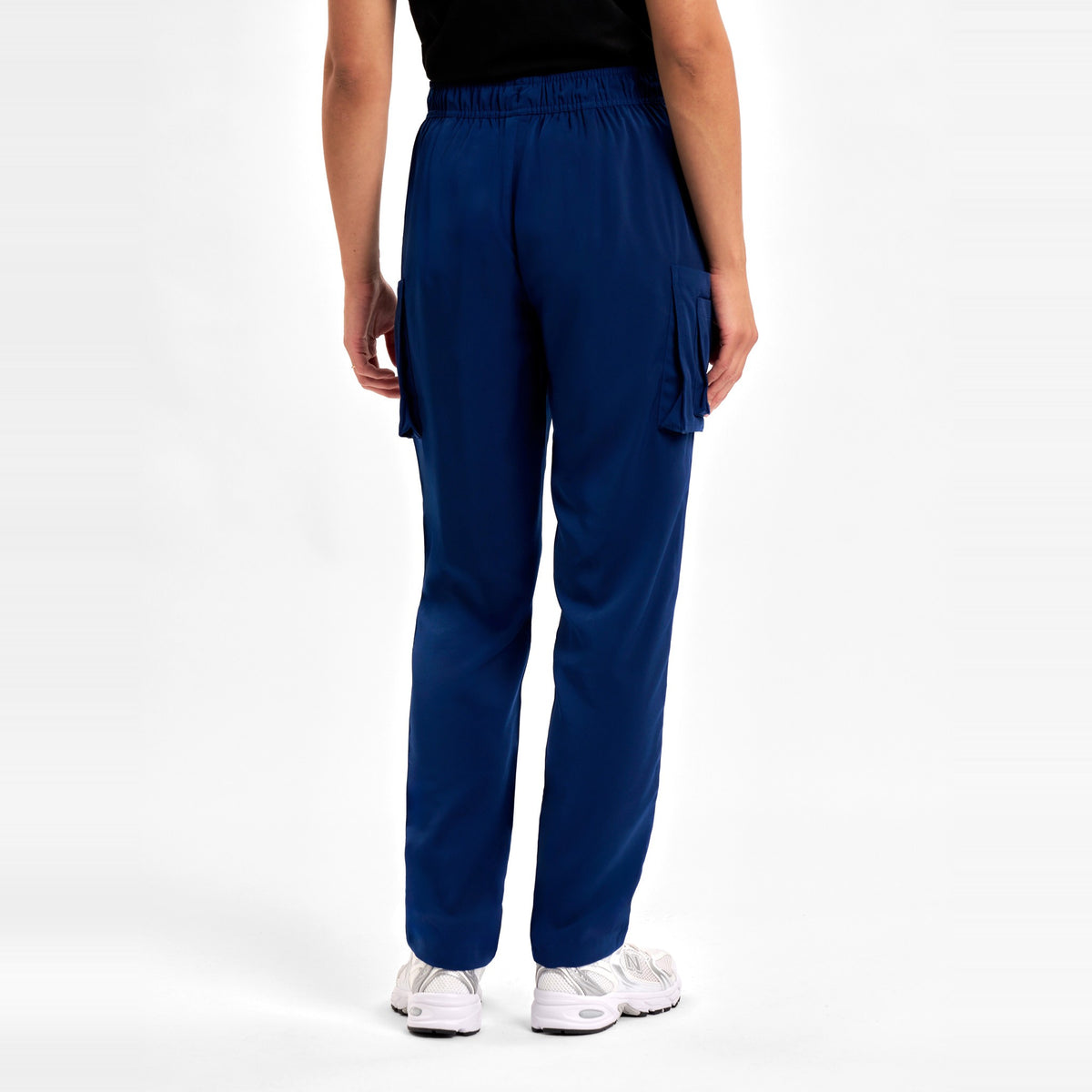 Inaura Avery Womens Slim Leg Scrub Pant CSP943LL in Navy, worn by model, view 4