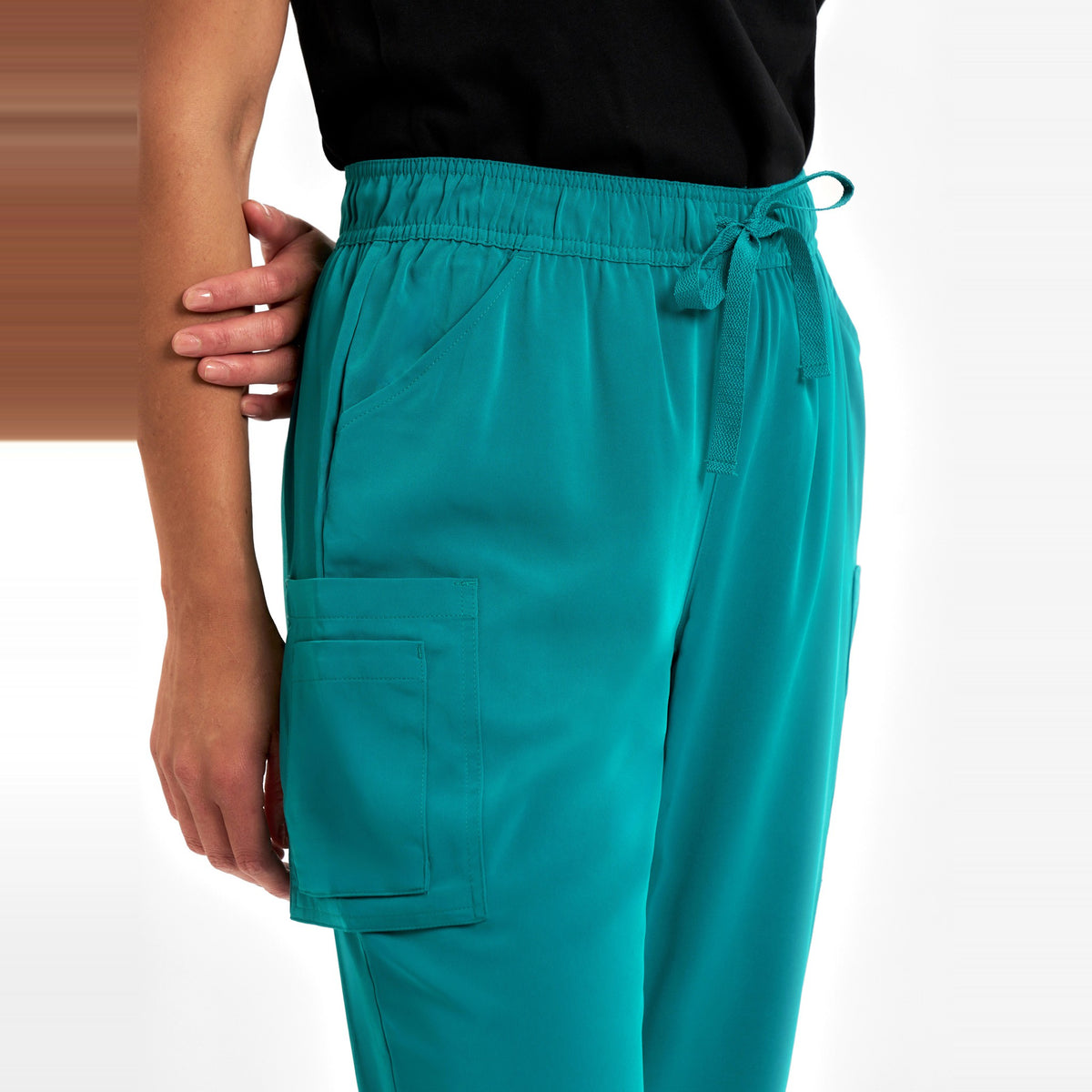 Inaura Avery Womens Slim Leg Scrub Pant CSP943LL in Teal, worn by model, view 5