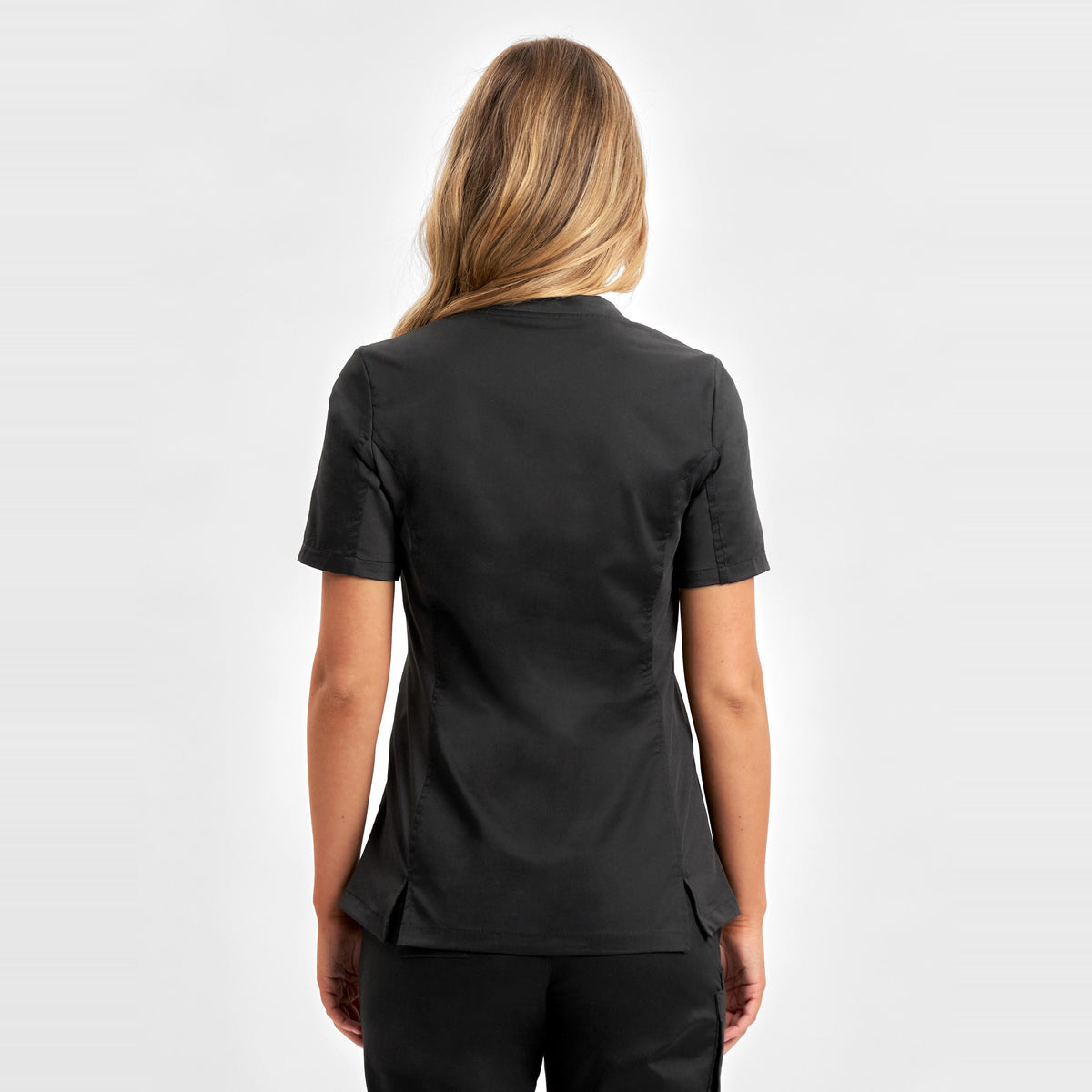 Inaura Riley Womens Stretch Scrub Top CST043LS in Black, worn by model, view 4
