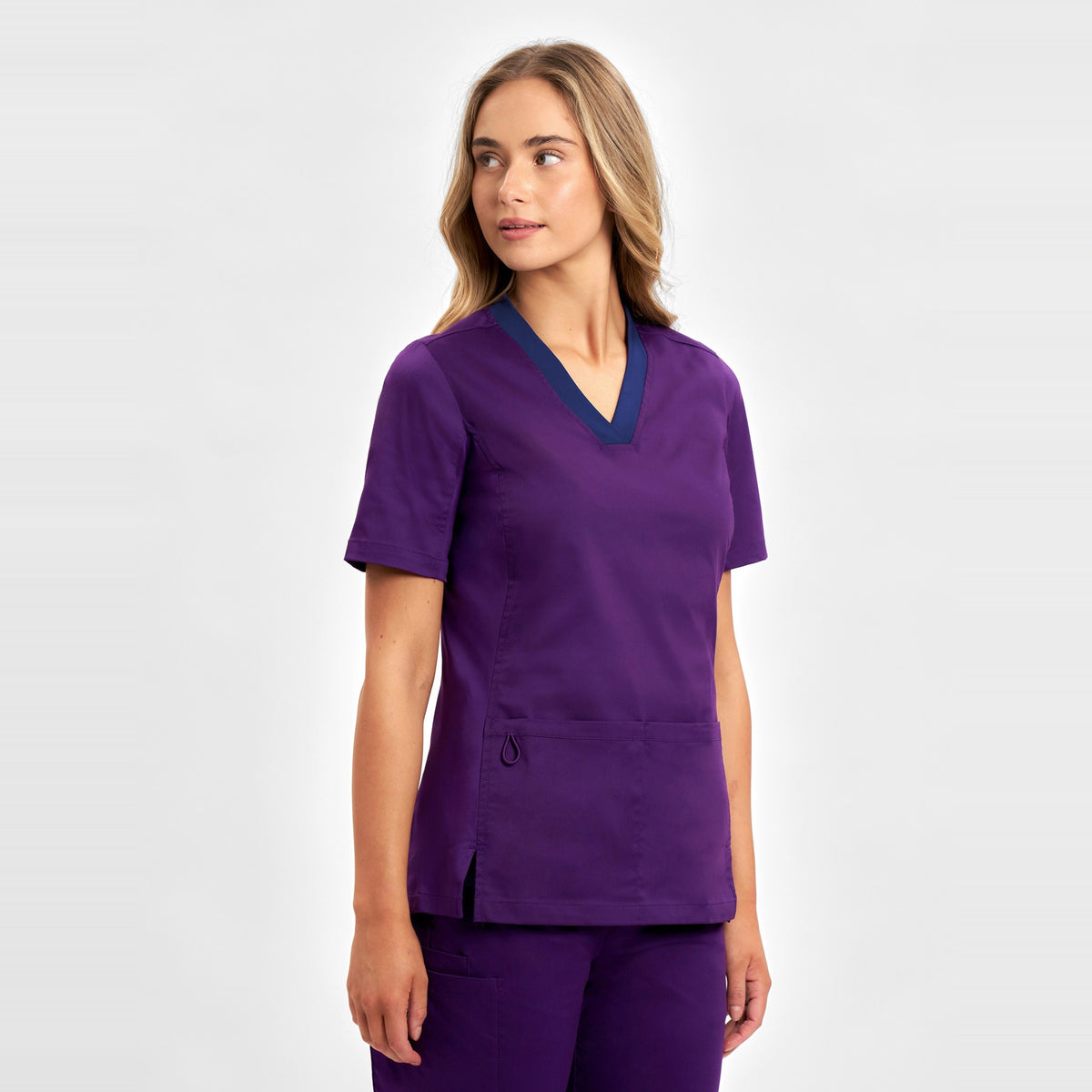 Inaura Riley Womens Stretch Scrub Top CST043LS in Purple, worn by model, view 3