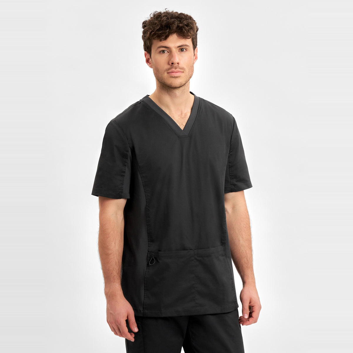 Inaura Riley Mens Stretch Scrub Top CST043MS in Black, worn by model