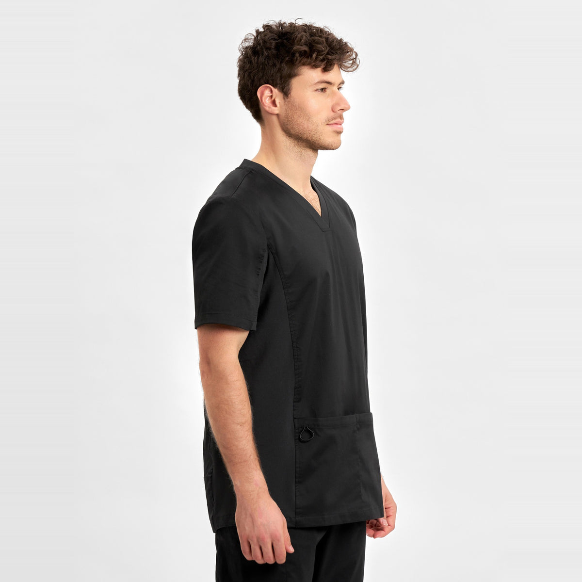 Inaura Riley Mens Stretch Scrub Top CST043MS in Black, worn by model, view 3