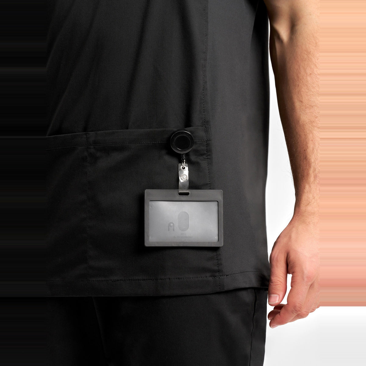 Inaura Riley Mens Stretch Scrub Top CST043MS in Black, worn by model, view 6