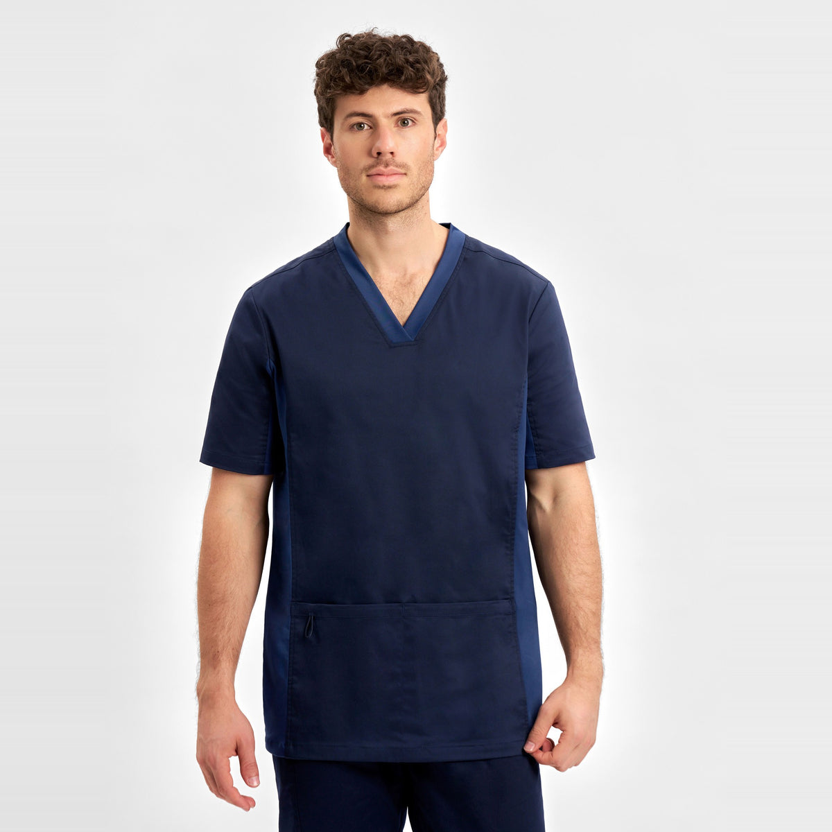 Inaura Riley Mens Stretch Scrub Top CST043MS in Midnight Navy, worn by model