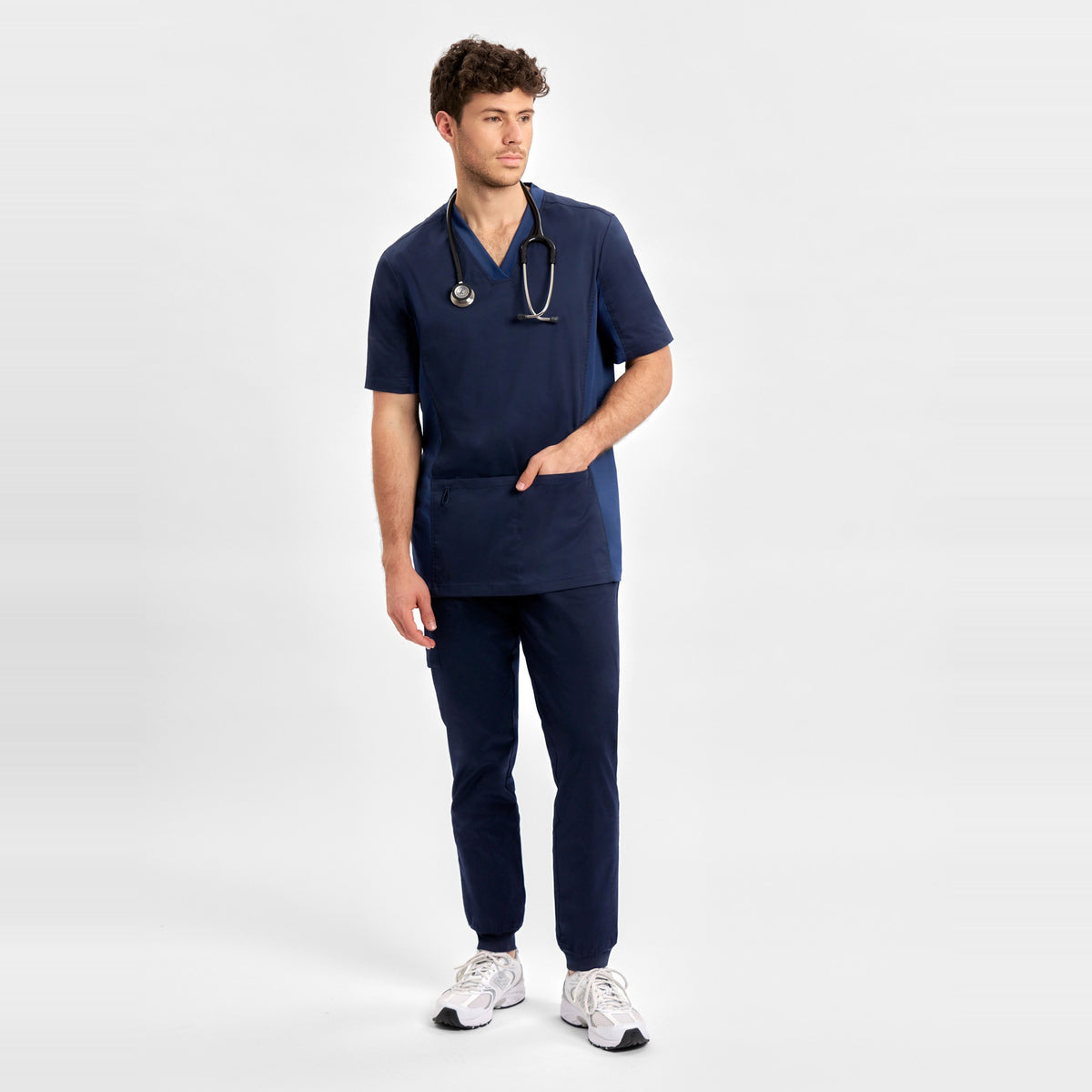 Inaura Riley Mens Stretch Scrub Top CST043MS in Midnight Navy, worn by model, view 2