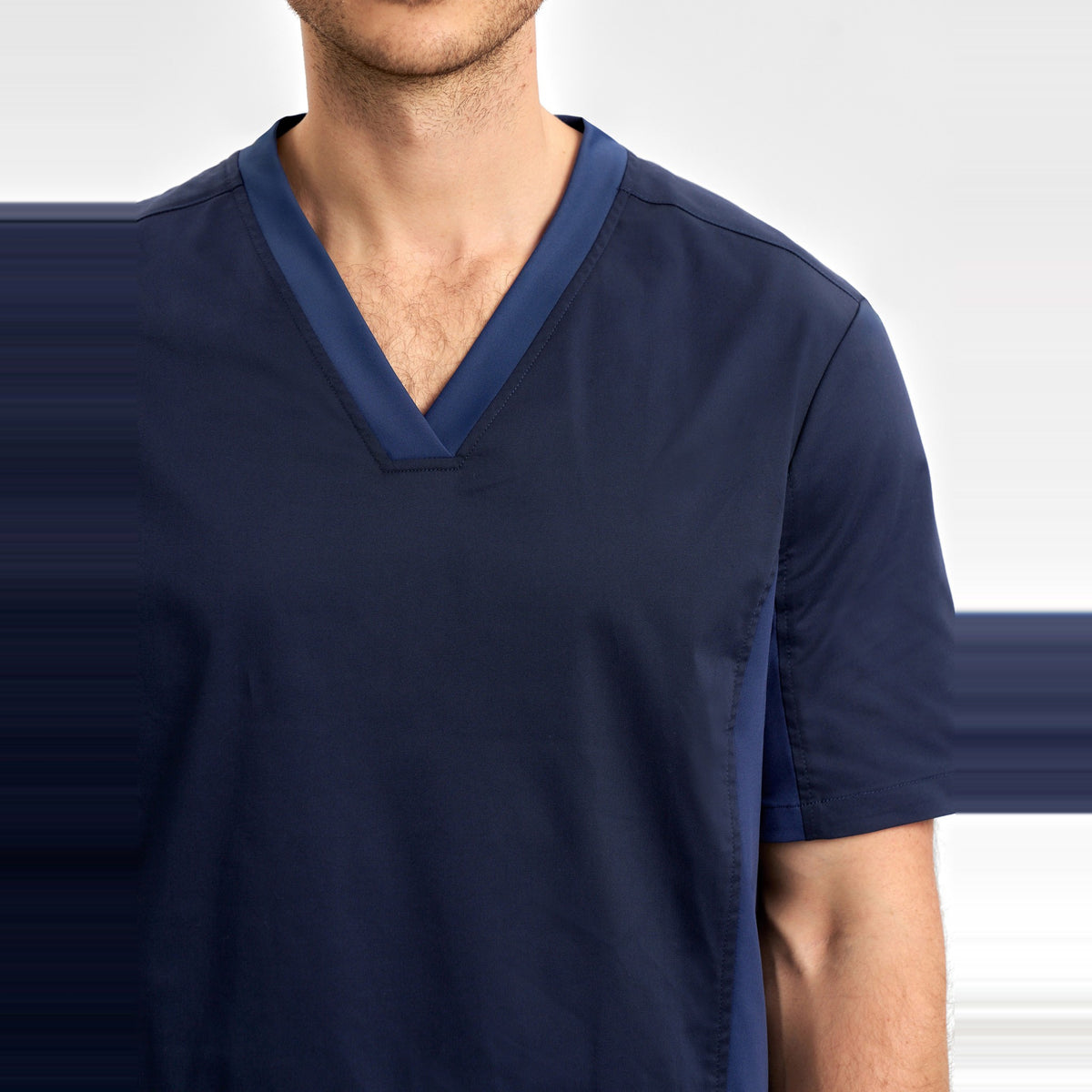 Inaura Riley Mens Stretch Scrub Top CST043MS in Midnight Navy, worn by model, view 5