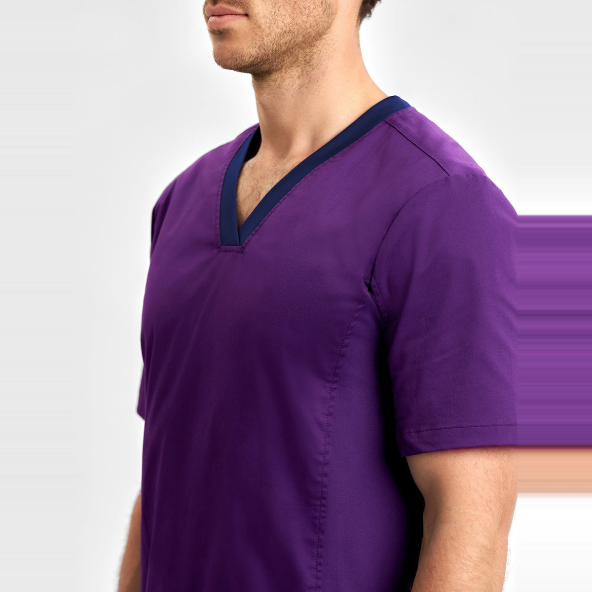 Inaura Riley Mens Stretch Scrub Top CST043MS in Purple, worn by model, view 5