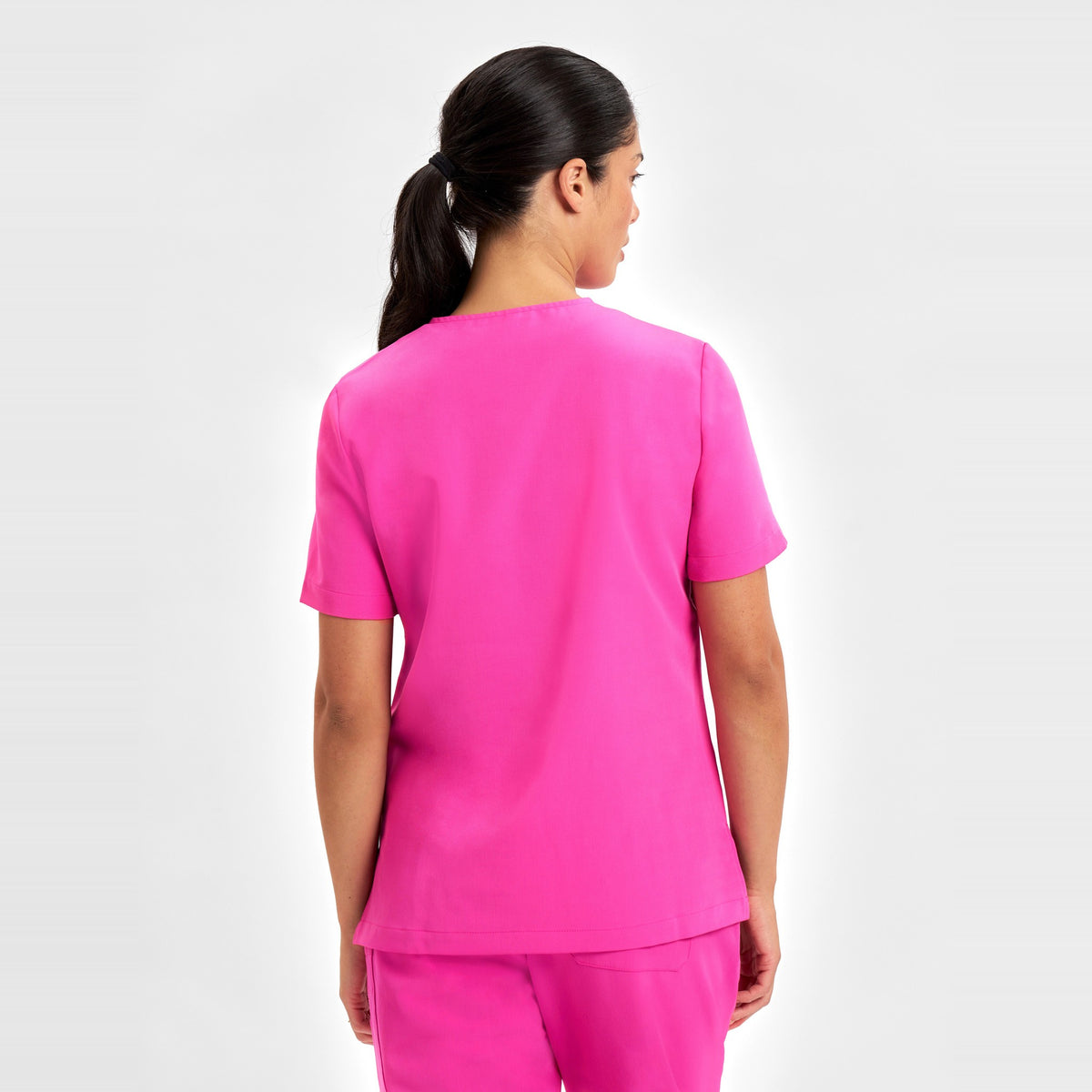 Inaura Pink Womens V-Neck Scrub Top CST245LS in Pink, worn by model, view 4