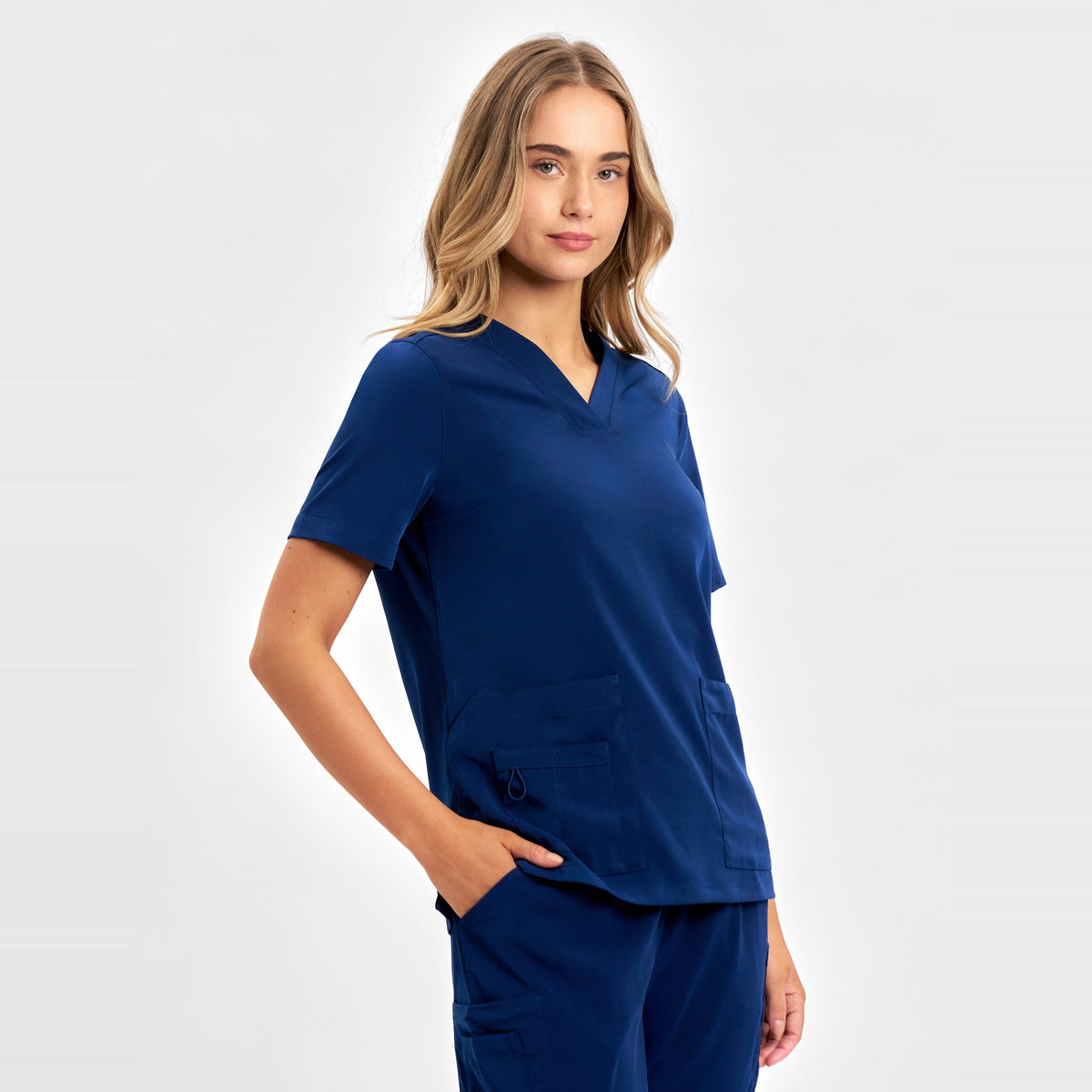 Inaura Avery Womens V-Neck Scrub Top CST941LS in Navy, worn by model, view 3