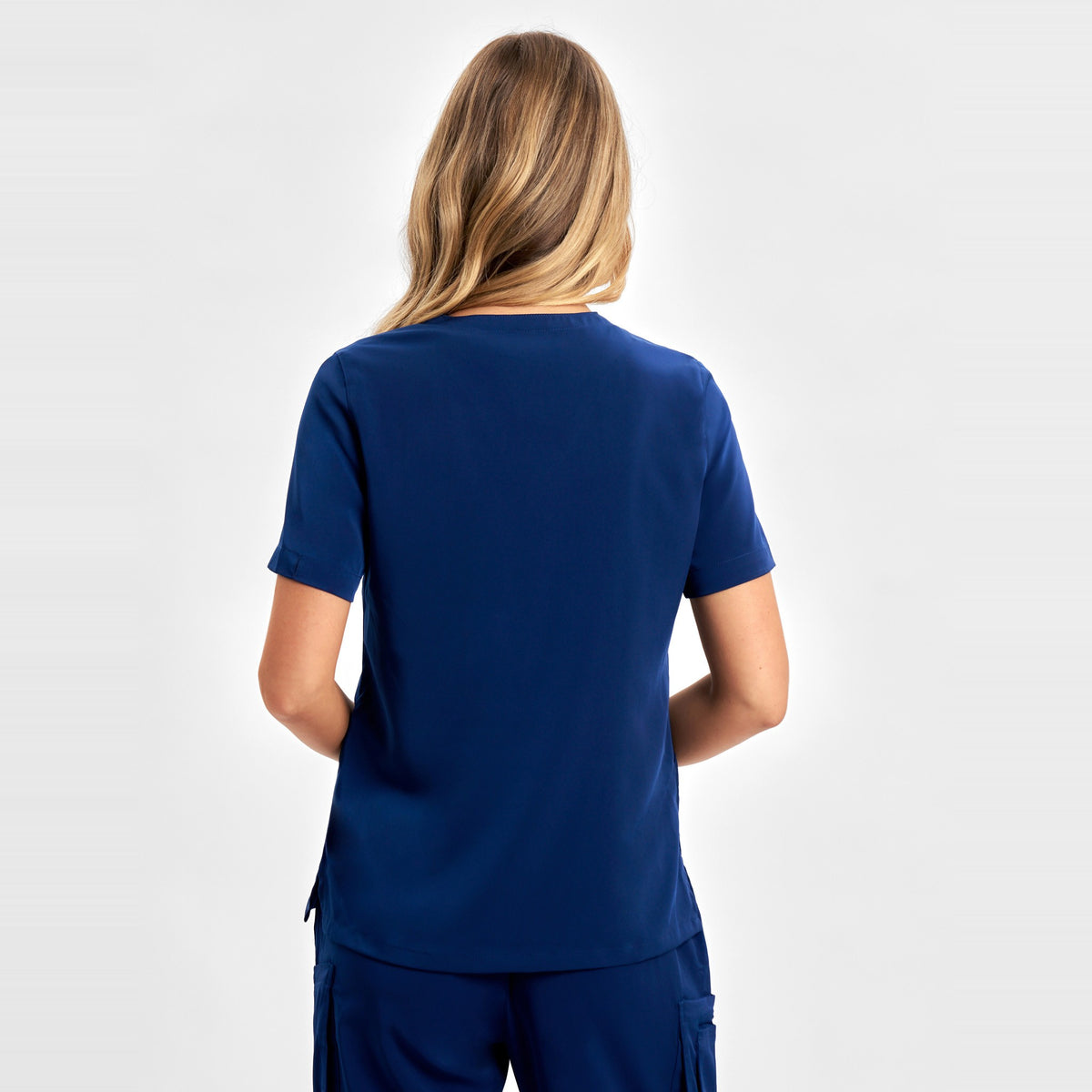 Inaura Avery Womens V-Neck Scrub Top CST941LS in Navy, worn by model, view 4