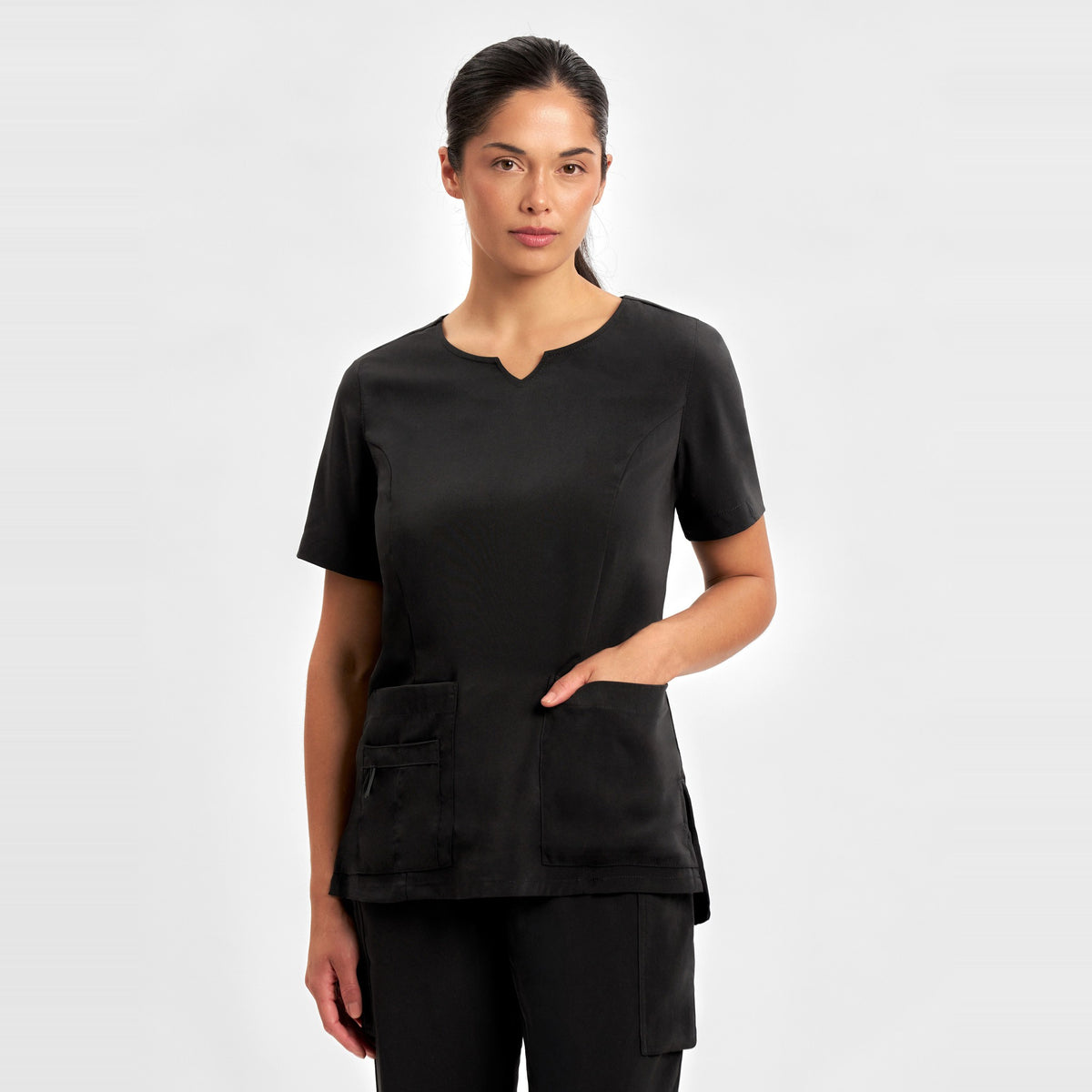 Inaura Avery Womens Round Neck Scrub Top CST942LS in Black, worn by model