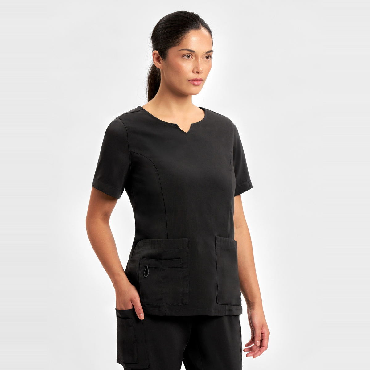 Inaura Avery Womens Round Neck Scrub Top CST942LS in Black, worn by model, view 3