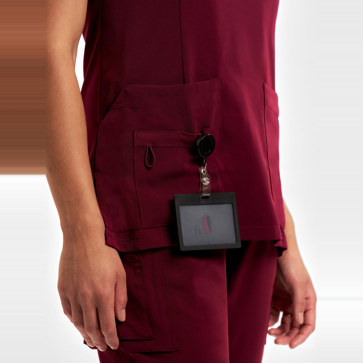Inaura Avery Womens Round Neck Scrub Top CST942LS in Burgundy, worn by model, view 5