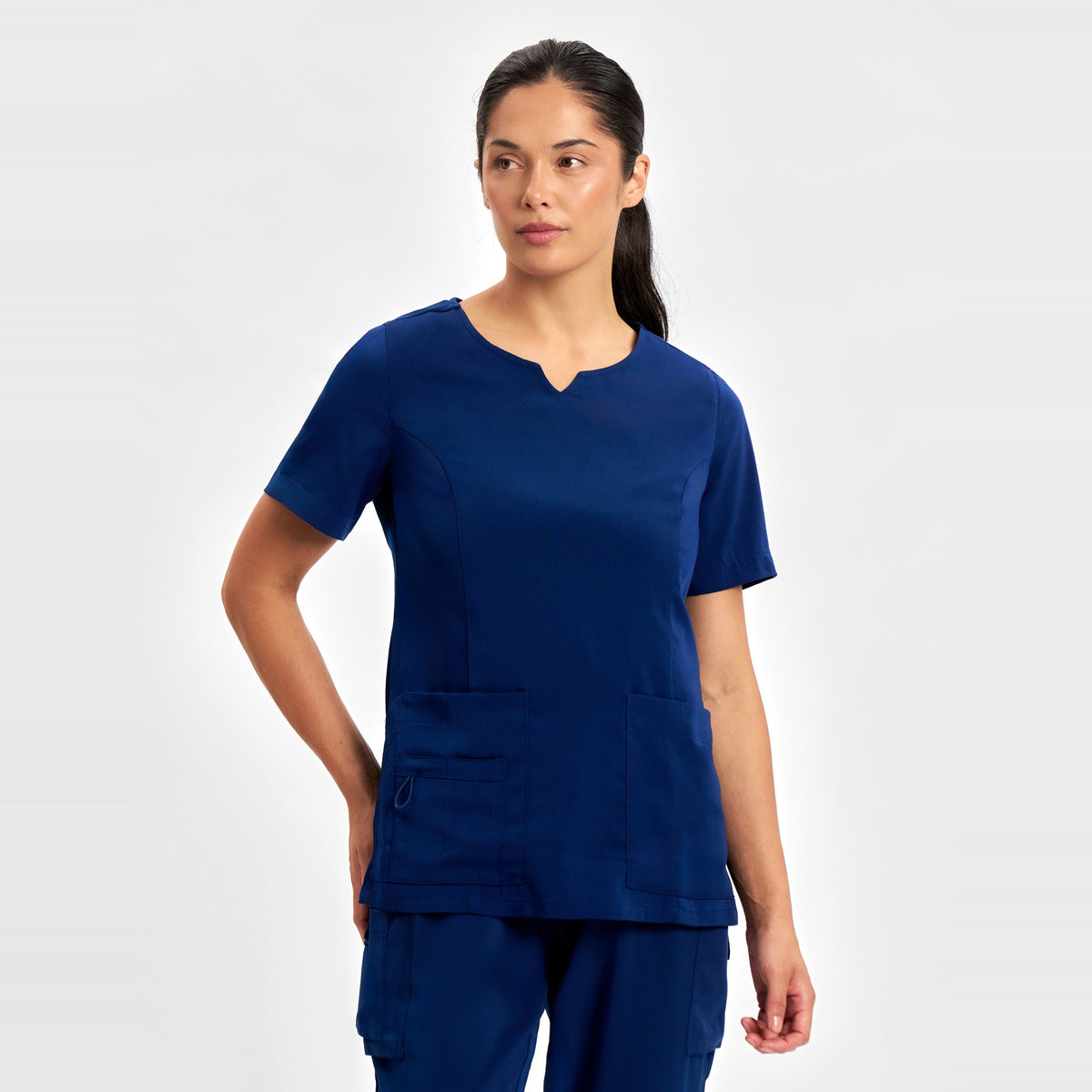 Inaura Avery Womens Round Neck Scrub Top CST942LS in Navy, worn by model