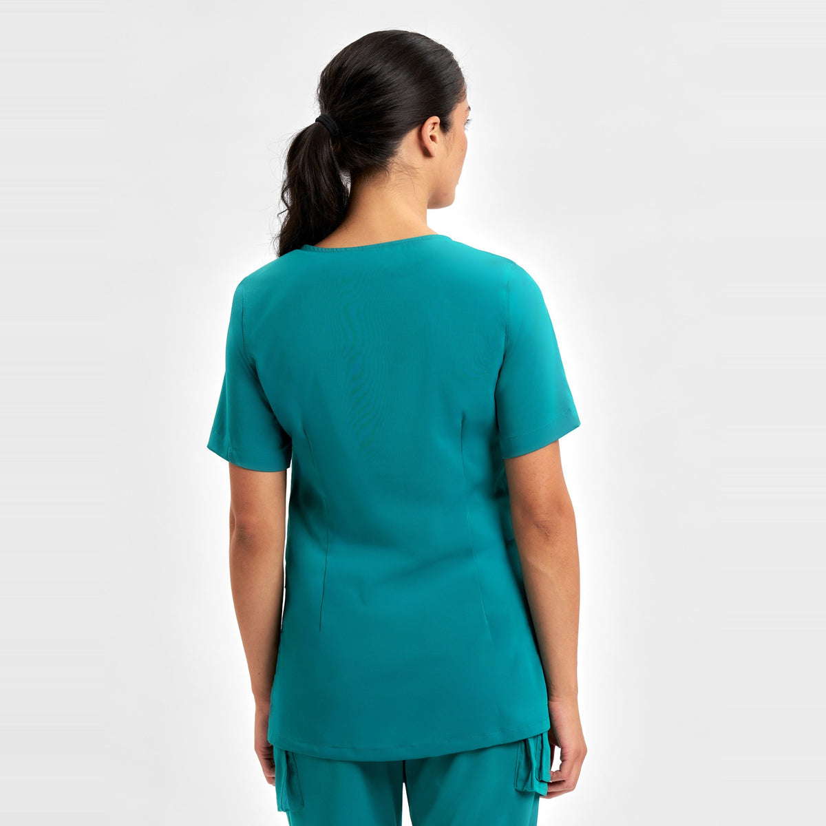 Inaura Avery Womens Round Neck Scrub Top CST942LS in Teal, worn by model, view 4