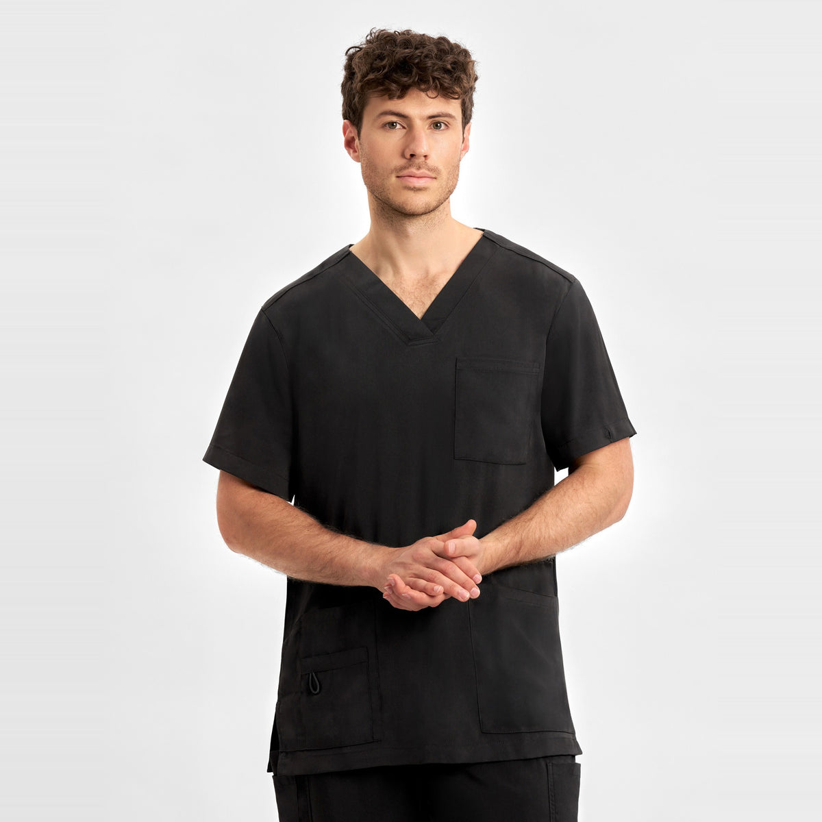 Inaura Avery Mens V-Neck Scrub Top CST945MS in Black, worn by model