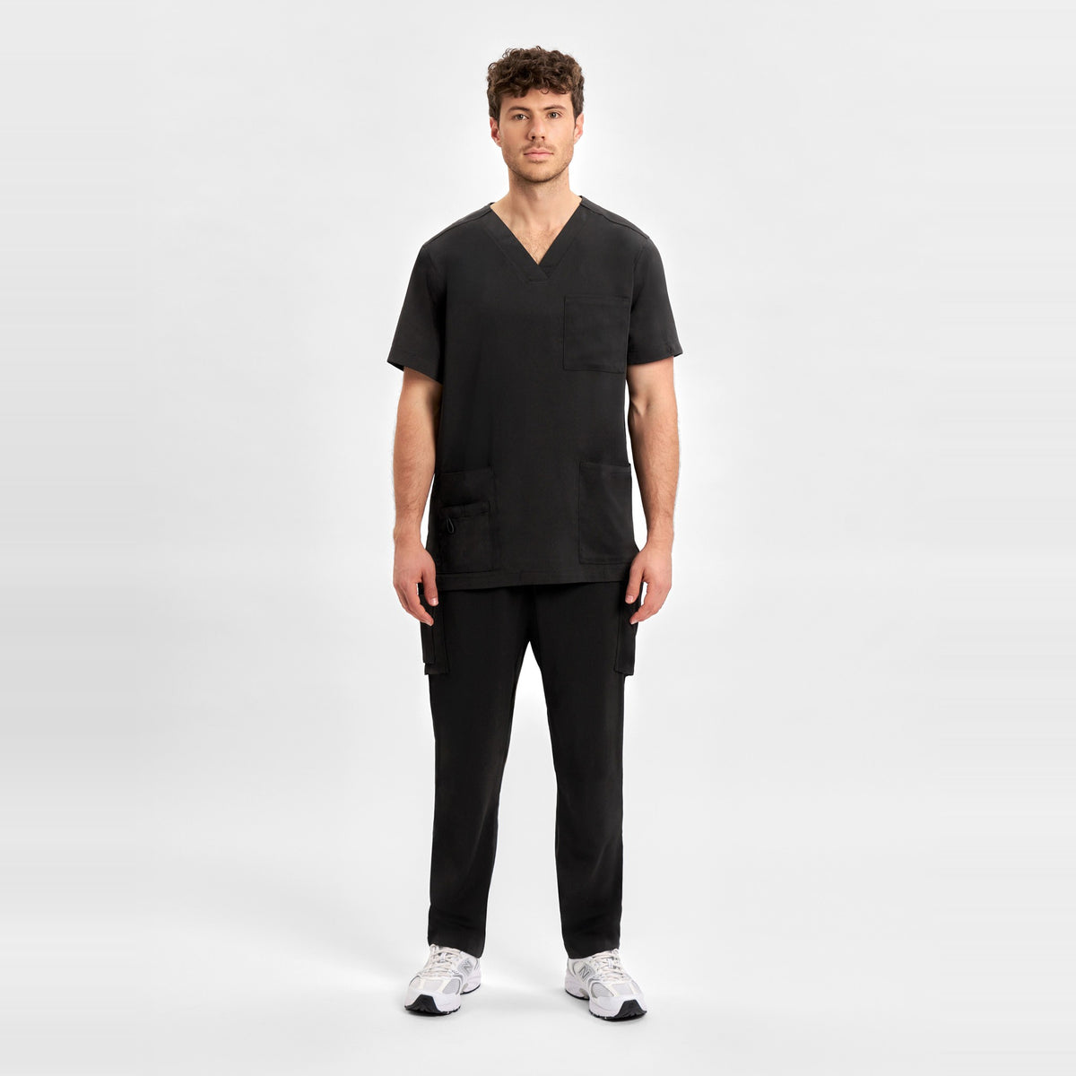 Inaura Avery Mens V-Neck Scrub Top CST945MS in Black, worn by model, view 2