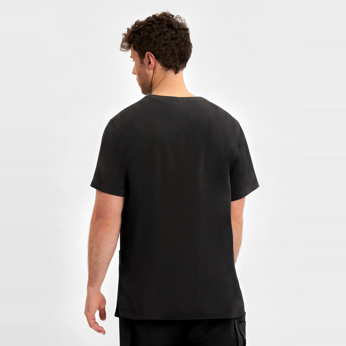 Inaura Avery Mens V-Neck Scrub Top CST945MS in Black, worn by model, view 4