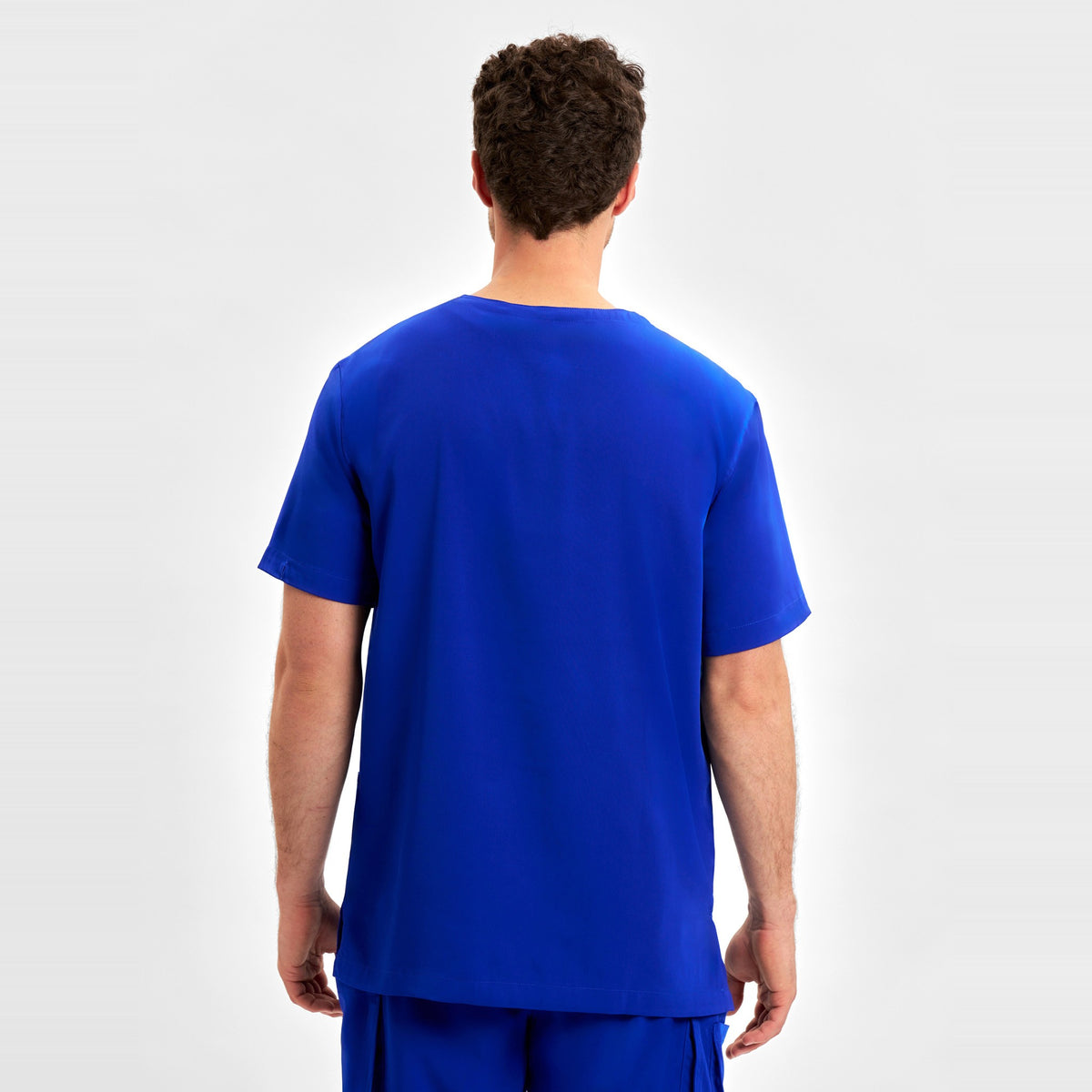 Inaura Avery Mens V-Neck Scrub Top CST945MS in Electric Blue, worn by model, view 4