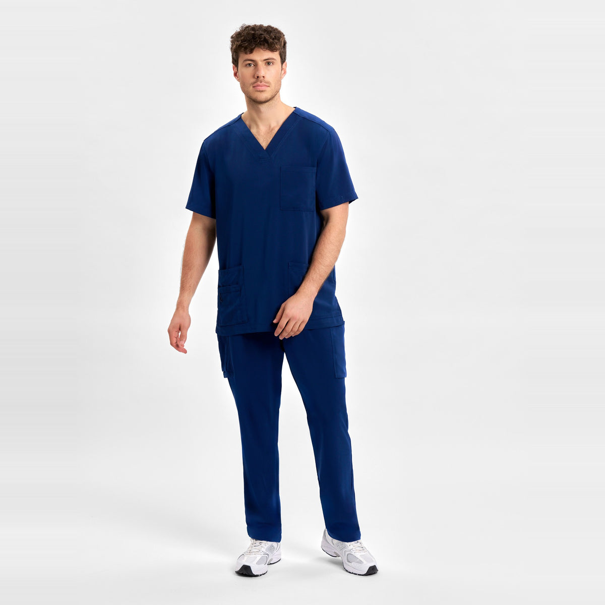 Inaura Avery Mens V-Neck Scrub Top CST945MS in Navy, worn by model, view 2