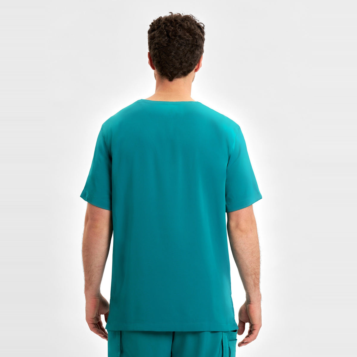 Inaura Avery Mens V-Neck Scrub Top CST945MS in Teal, worn by model, view 4