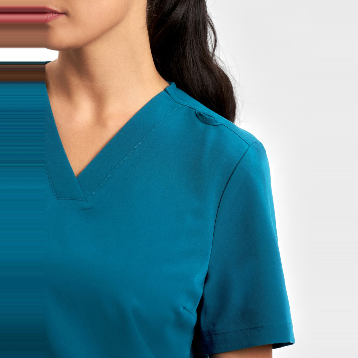Inaura Pulse Womens V-Neck Scrub Top CU543LS in Caribbean Blue, worn by model, view 5