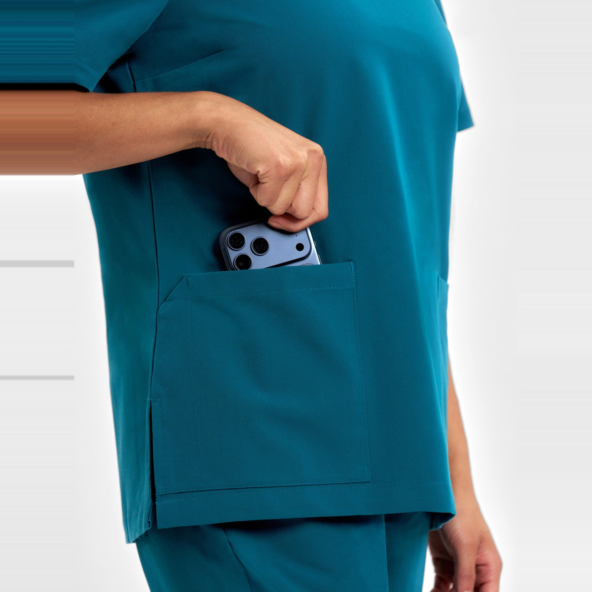 Inaura Pulse Womens V-Neck Scrub Top CU543LS in Caribbean Blue, worn by model, view 6
