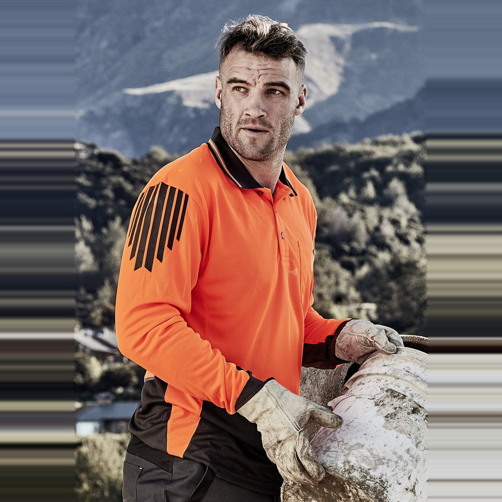 Syzmik Mens Hi Vis Flux Long Sleeve Polo ZH310 in Orange/Charcoal, worn by model