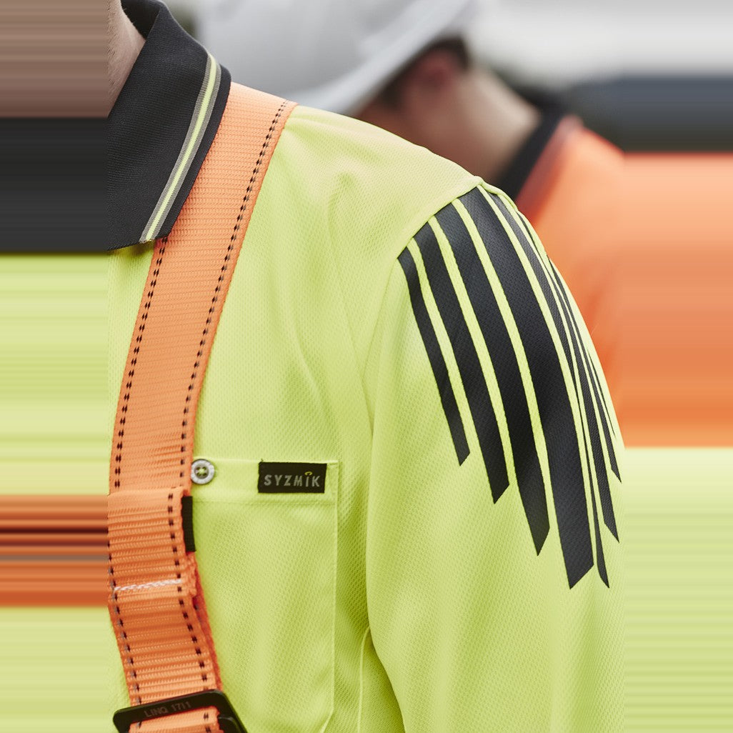 Syzmik Mens Hi Vis Flux Long Sleeve Polo ZH310 in Yellow/Navy, worn by model, view 3