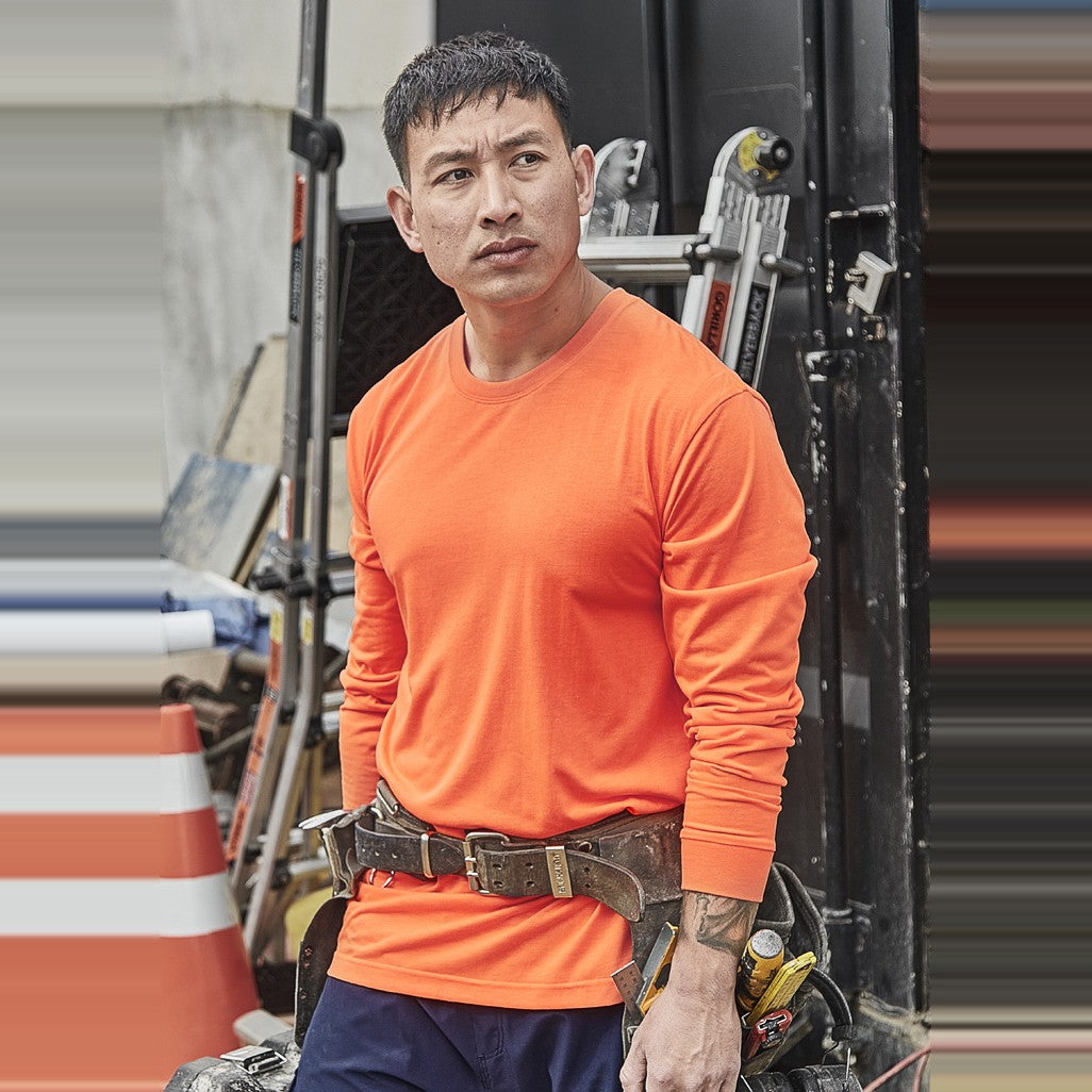 Syzmik Mens Hi Vis Long Sleeve Tee ZH390 in Orange, worn by model