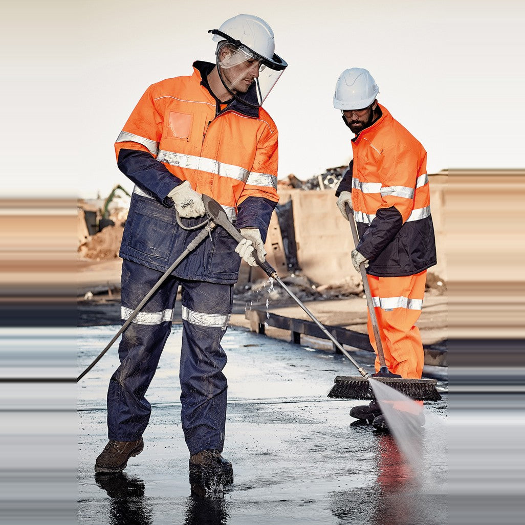 Syzmik Mens Hi Vis Taped Storm Pant ZJ352 in Navy, worn by model