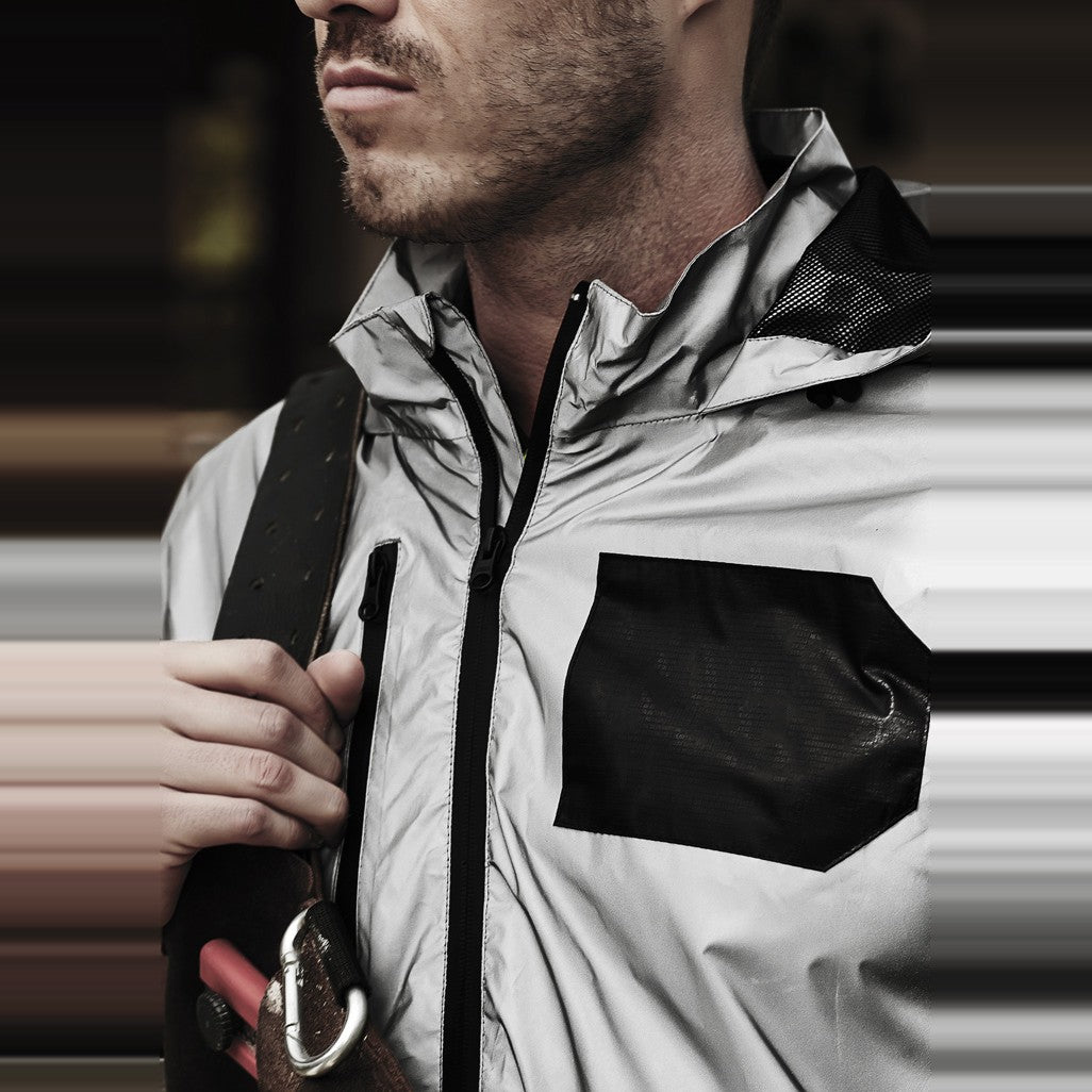 Syzmik Unisex Streetworx Reflective Waterproof Jacket ZJ380 in Reflective Silver, worn by model, view 3