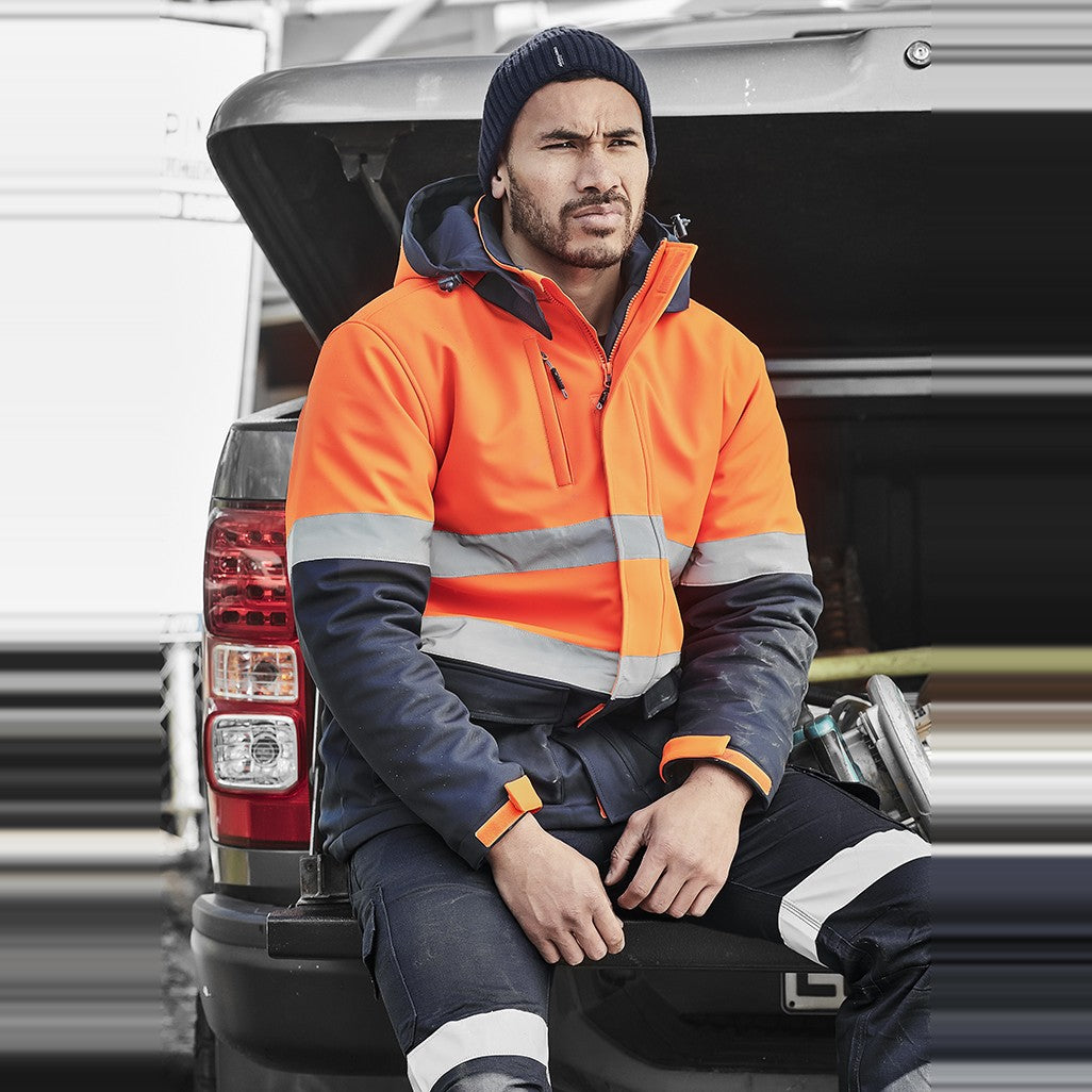 Syzmik Unisex Hi Vis Antarctic Softshell Jacket ZJ553, worn by model